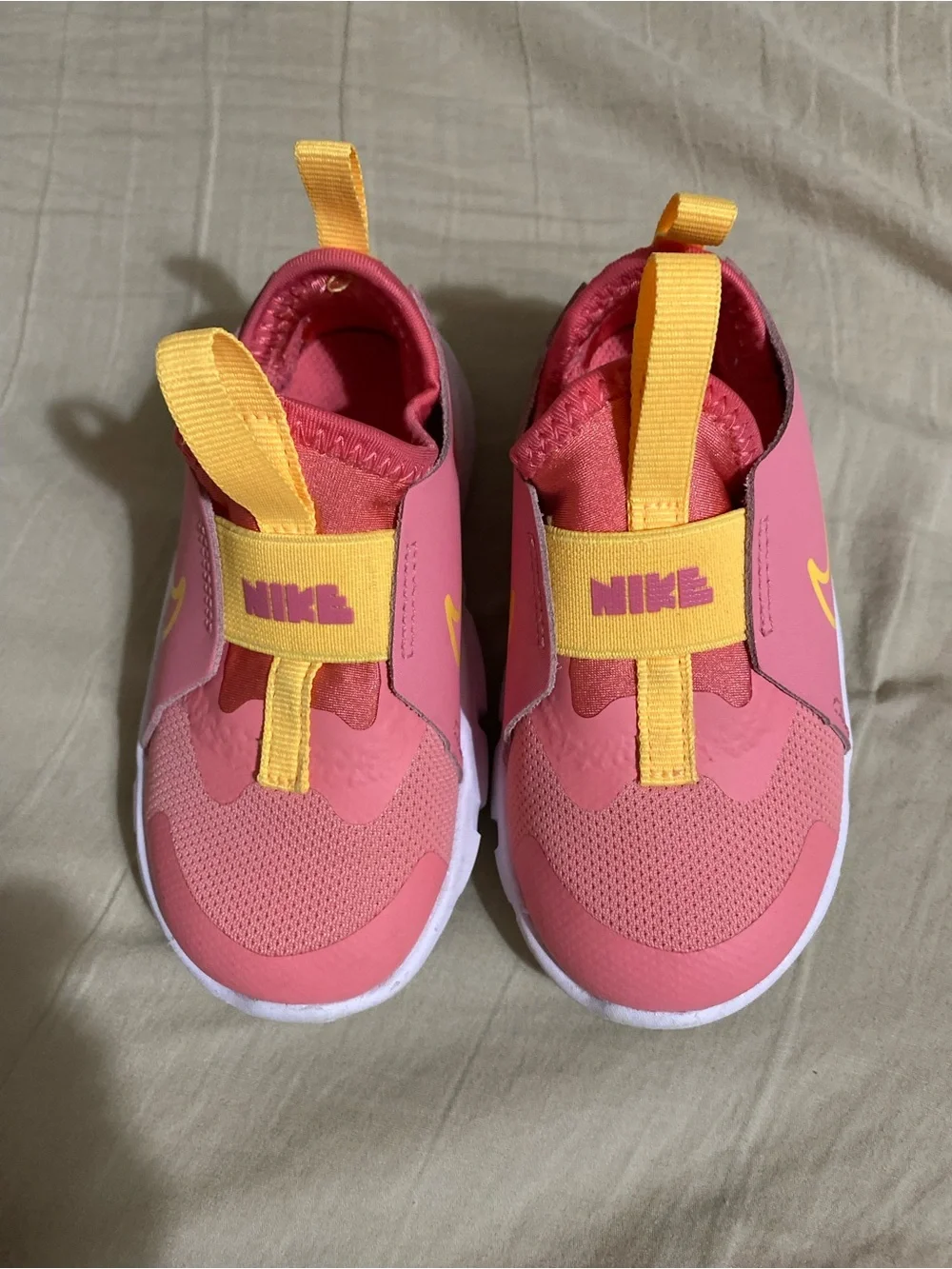 Nike Kids Pink Slip-On Sneakers with Yellow Accents